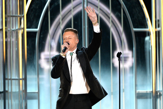 The rapper Macklemore performs onstage during the 56th Grammy Awards on Sunday. Kevork Djansezian/Getty Images